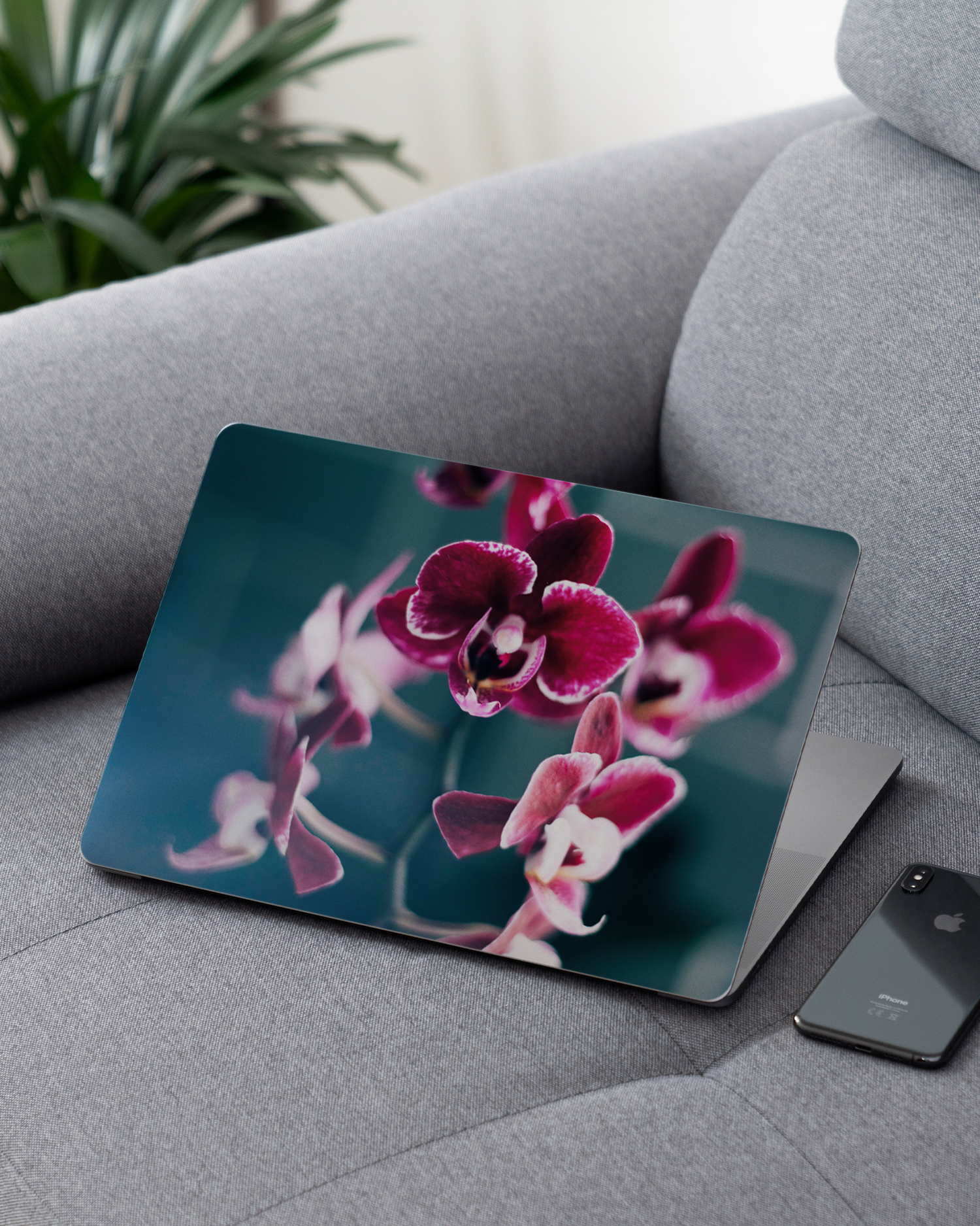 Orchid Laptop Skin for 13 inch Apple MacBooks on a couch