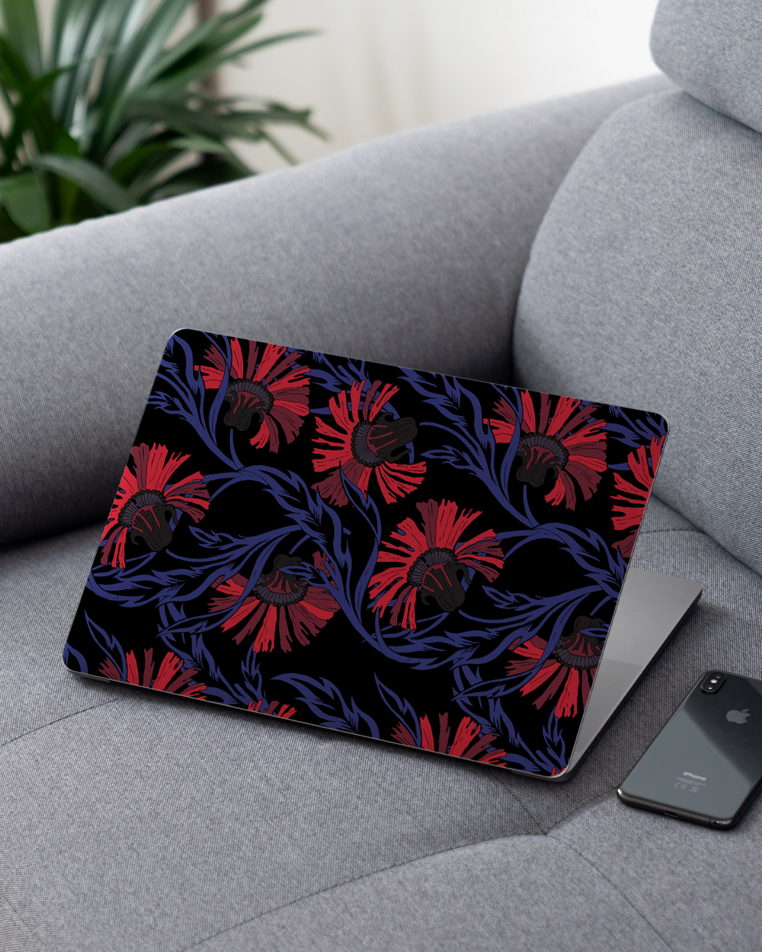 Midnight Floral Laptop Skin for 13 inch Apple MacBooks on a couch