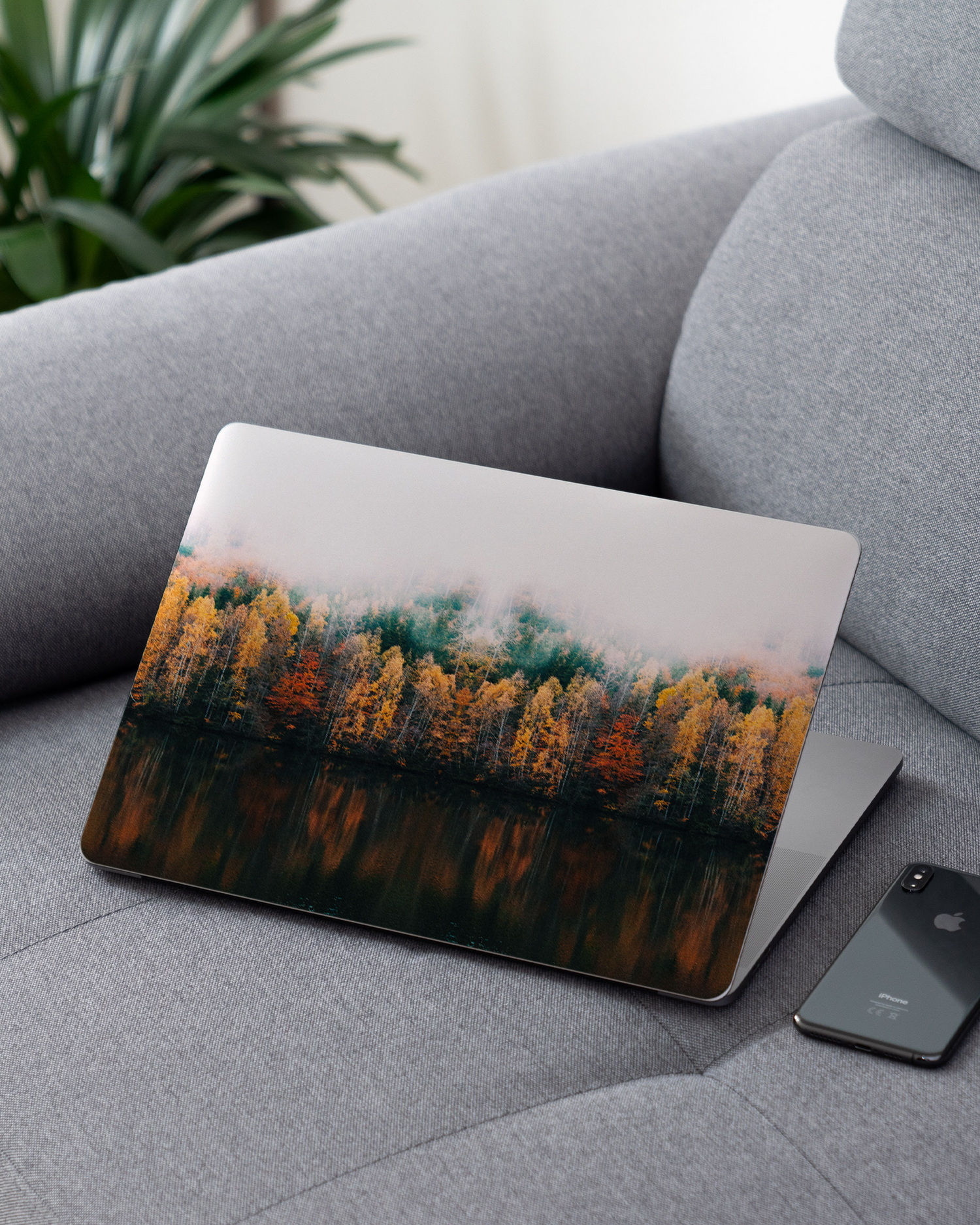 Fall Fog Laptop Skin for 13 inch Apple MacBooks on a couch