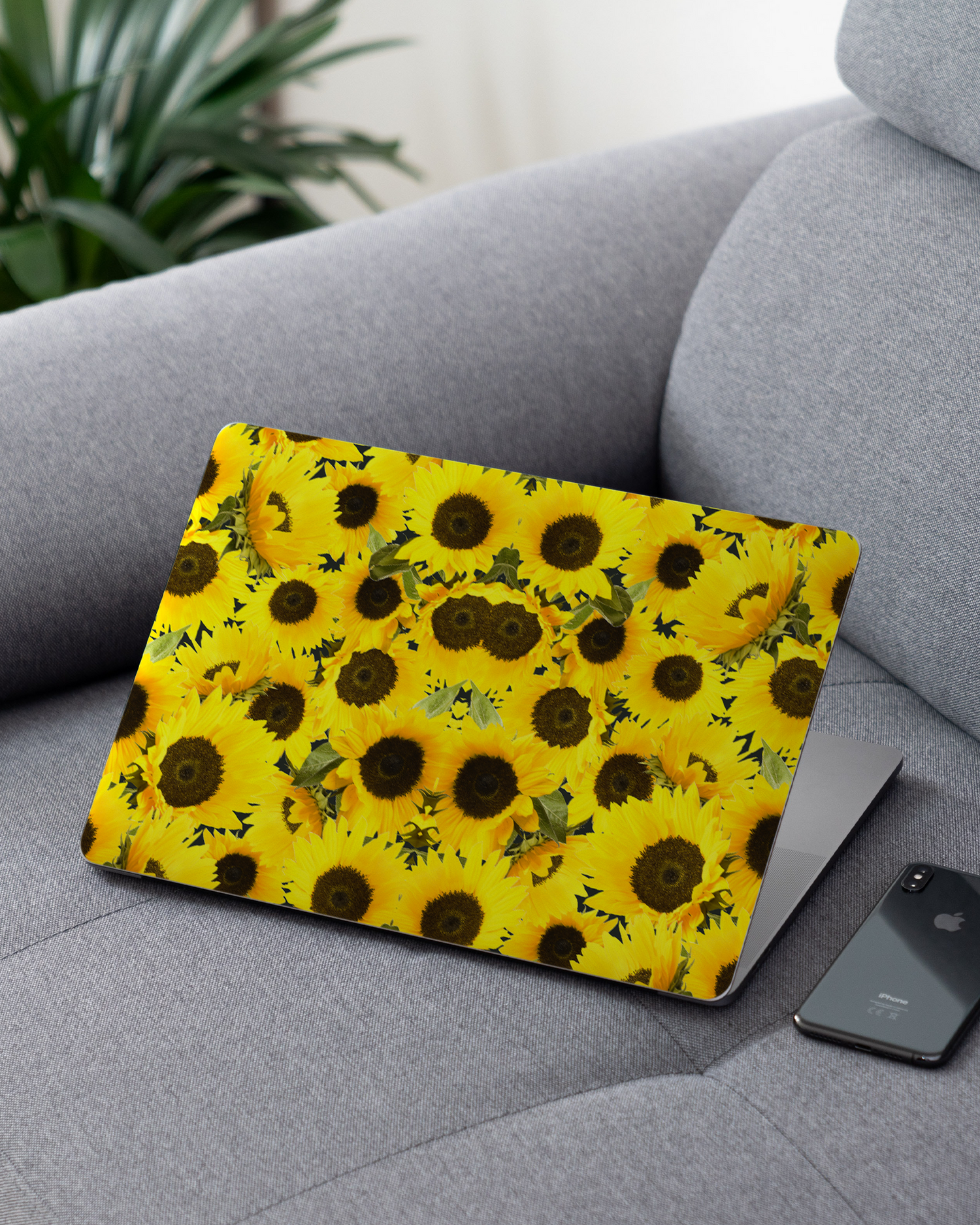 Sunflowers Laptop Skin for 13 inch Apple MacBooks on a couch