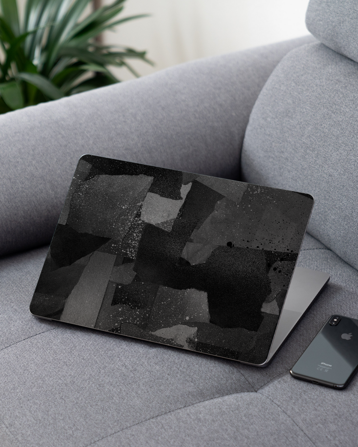 Torn Paper Collage Laptop Skin for 13 inch Apple MacBooks on a couch