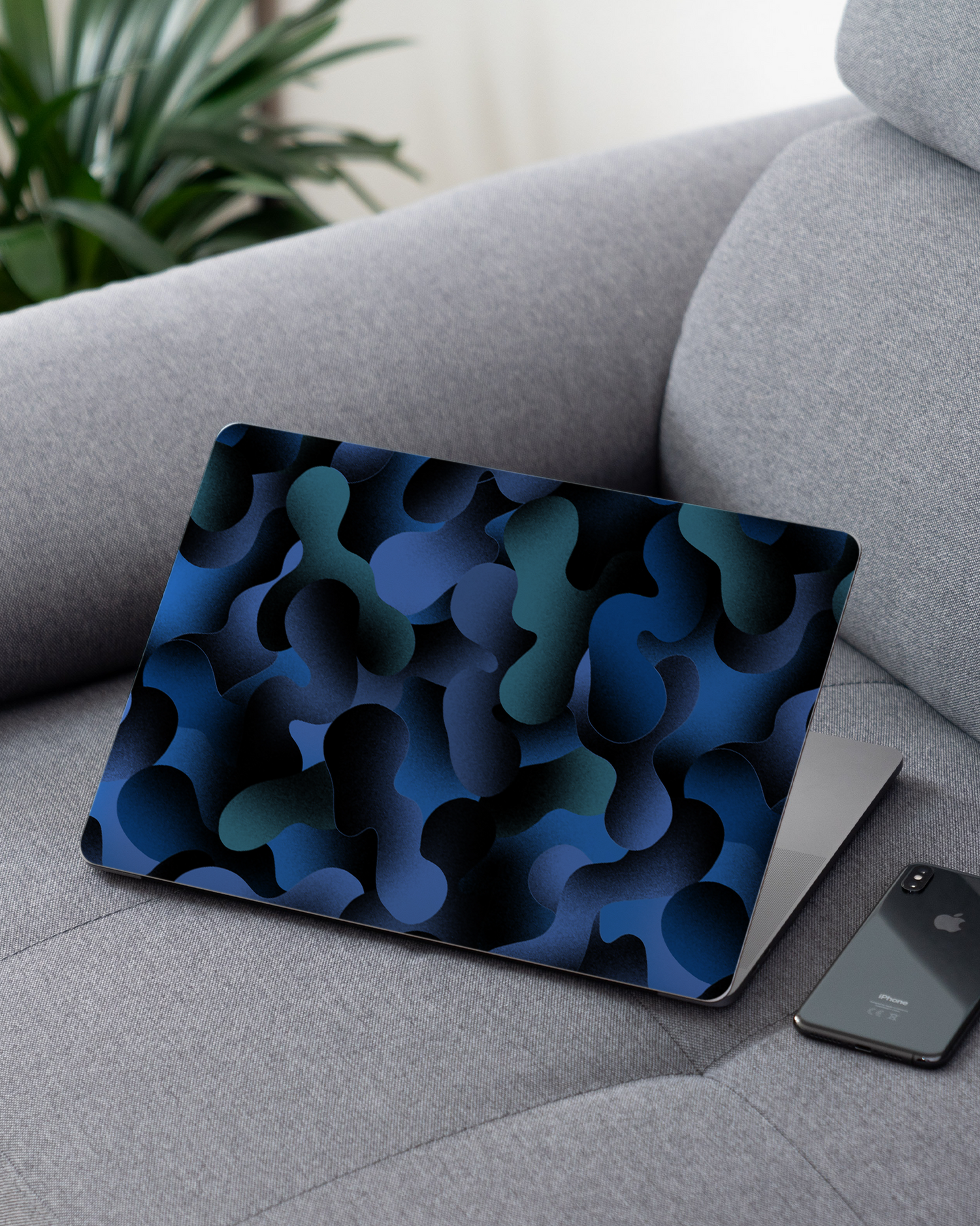 Night Moves Laptop Skin for 13 inch Apple MacBooks on a couch