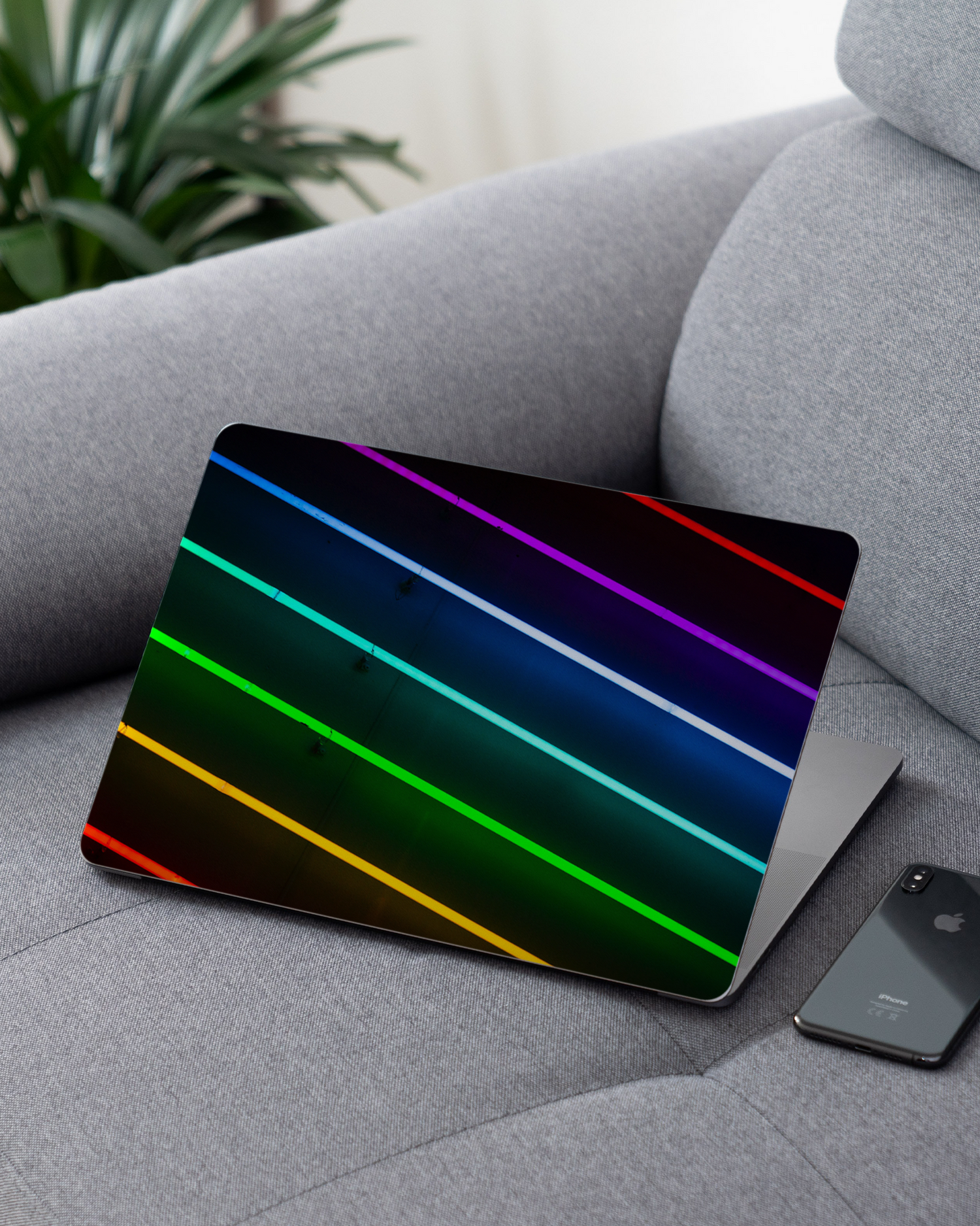 LGBTQ Laptop Skin for 13 inch Apple MacBooks on a couch