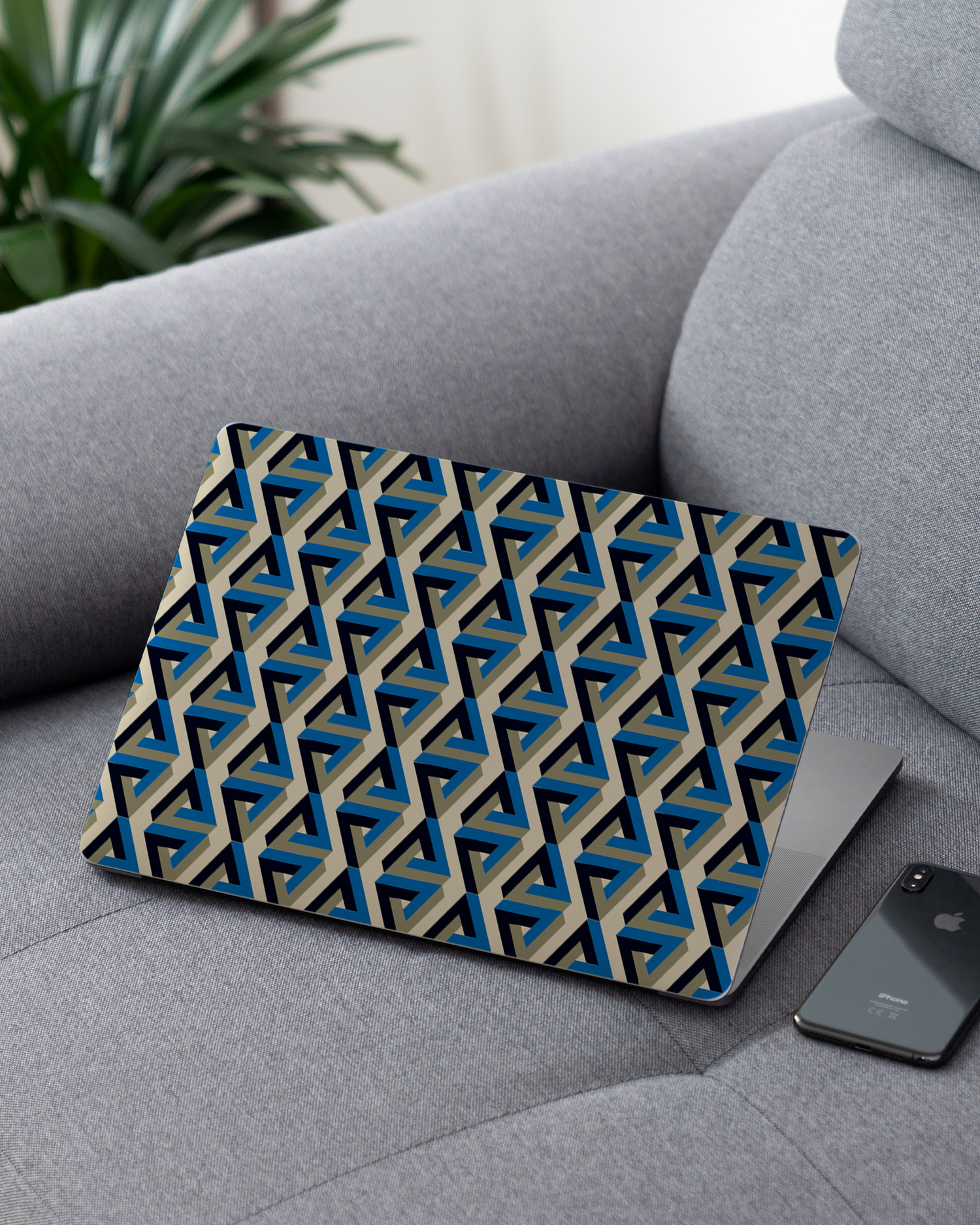 Penrose Pattern Laptop Skin for 13 inch Apple MacBooks on a couch